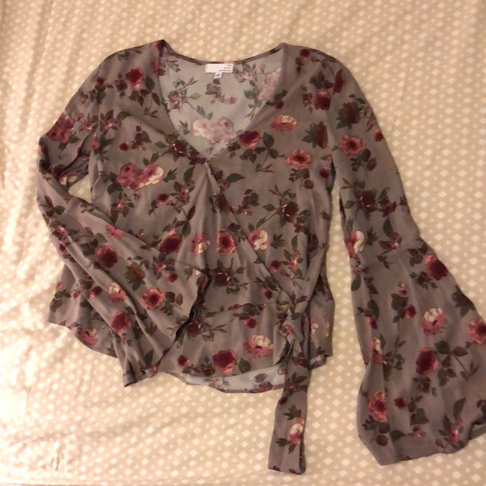 Bell sleeve floral top with front wrap.